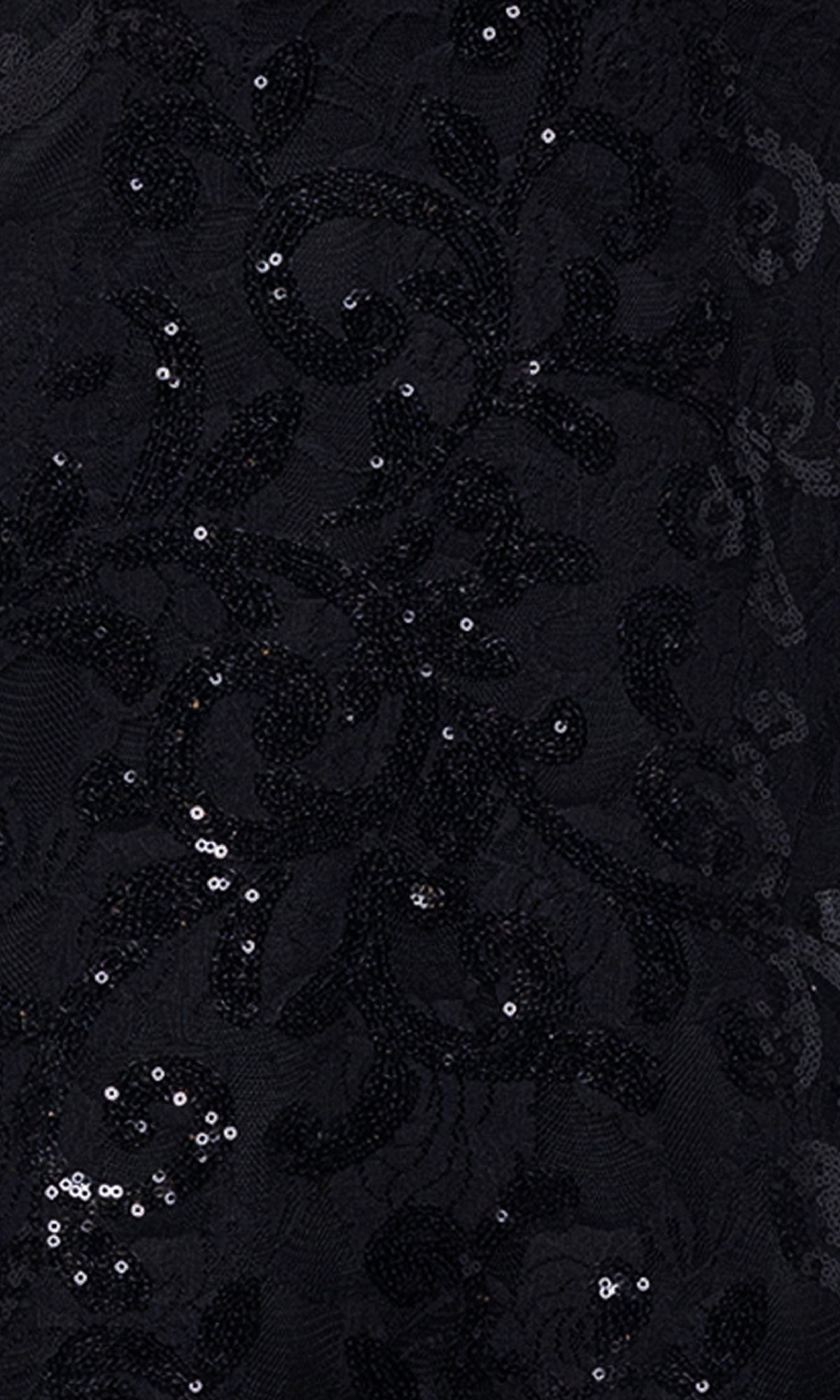 Close-up of black fabric with embroidered florals and scattered sequins, creating a subtle shine—ideal for a sheer corset bodice on the Black Sequin-Print Prom Dress: Blondie Nites 5213BN.